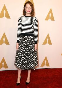 emma-stone-black-white-sweater-skirt-oscar-nominees-lunch-2015-main